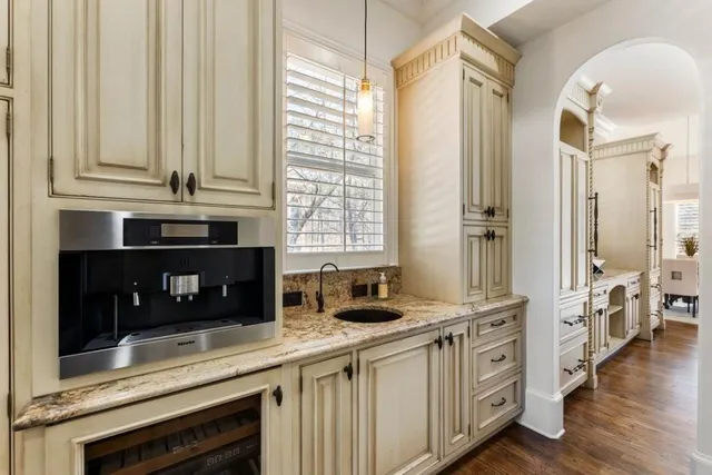 a kitchen with a stove and a sink