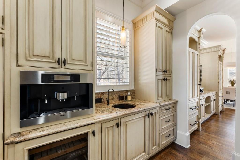 2250 Blackheath Trace Alpharetta, GA 30005 - Photo 23 of 51 a kitchen with stainless steel appliances a stove and white cabinets