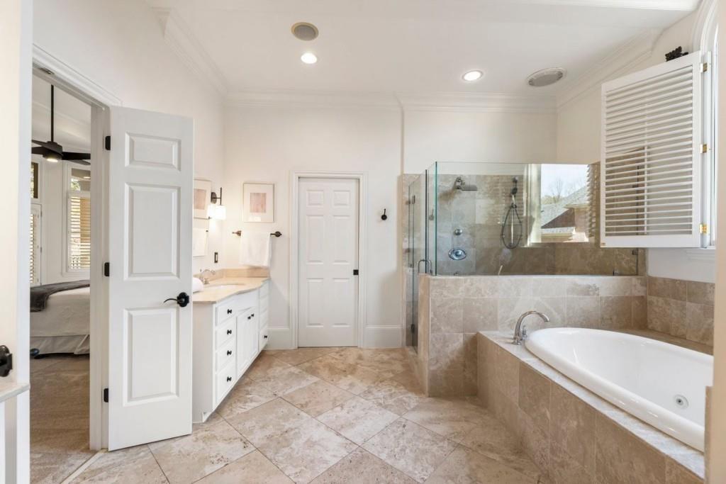 2250 Blackheath Trace Alpharetta, GA 30005 - Photo 27 of 51 a bathroom with a granite countertop sink a tub shower and mirror