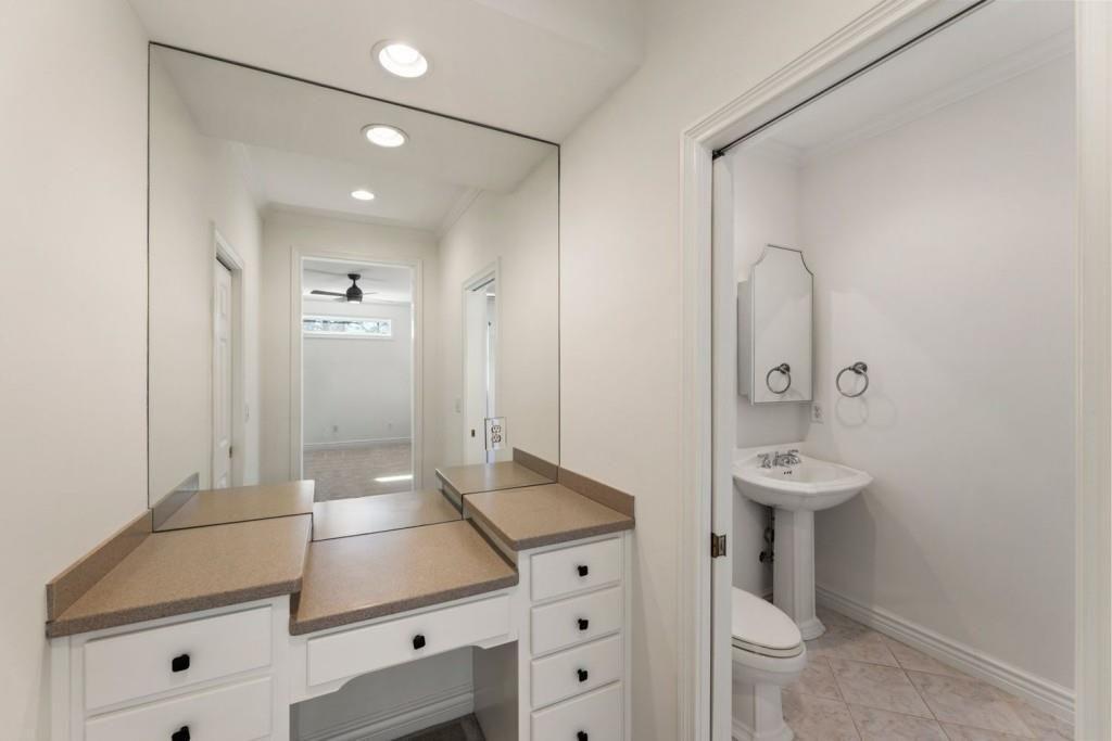 2250 Blackheath Trace Alpharetta, GA 30005 - Photo 33 of 51 a bathroom with a sink a toilet and a mirror