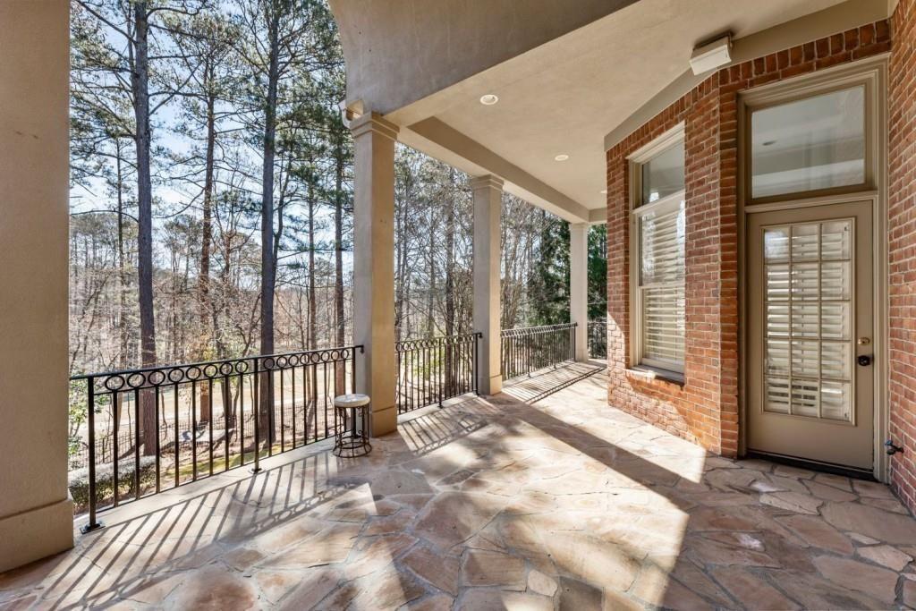 2250 Blackheath Trace Alpharetta, GA 30005 - Photo 42 of 51 a view of a large building with a large window and wooden floor