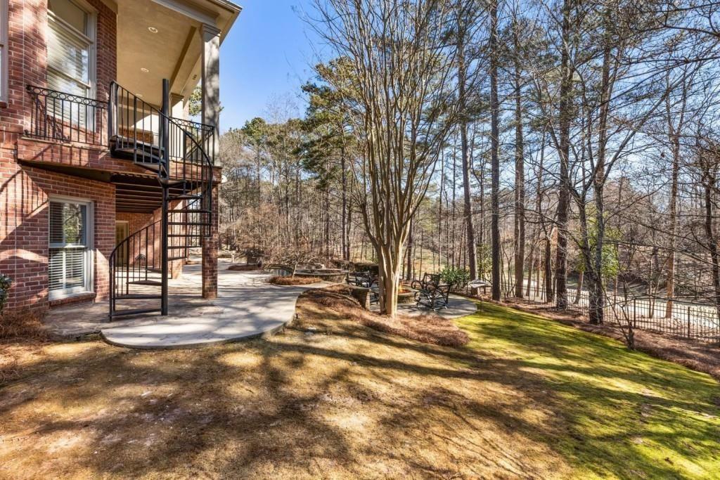 2250 Blackheath Trace Alpharetta, GA 30005 - Photo 44 of 51 a view of a street with houses on the roadside