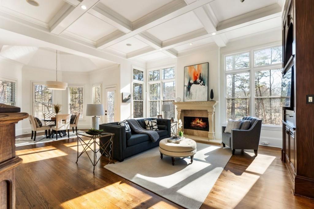2250 Blackheath Trace Alpharetta, GA 30005 - Photo 8 of 51 a living room with furniture large window and a fireplace