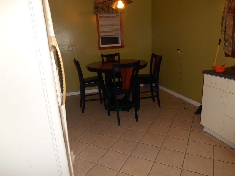 1214 Middlesex Street, Unit 1 Linden, NJ 07036 - Photo 2 of 5 a view of a dining room with furniture and wooden floor