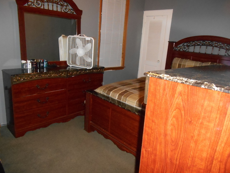 1214 Middlesex Street, Unit 1 Linden, NJ 07036 - Photo 5 of 5 a bedroom with a bed and a mirror