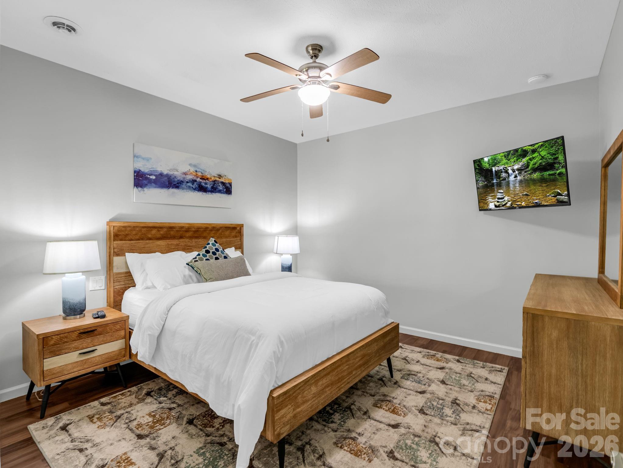 656 Cashiers Valley Road Brevard, NC 28712 - Photo 23 of 37 a bedroom with a bed and a couch