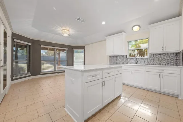 a kitchen with a sink and cabinets