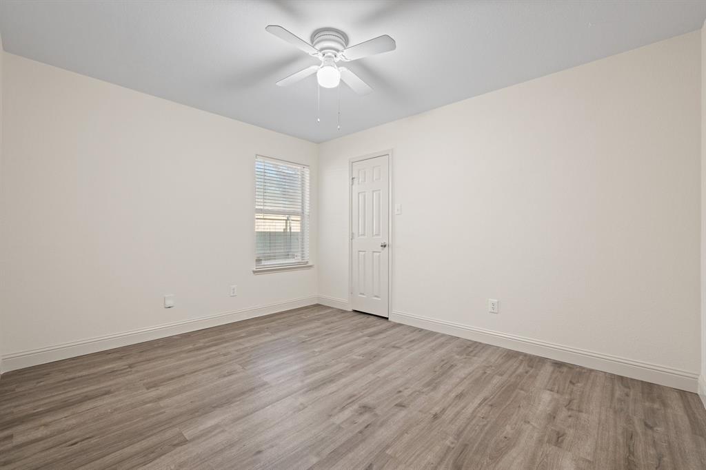 7103 Camp Creek Drive Arlington, TX 76002 - Photo 17 of 29 wooden floor in an empty room