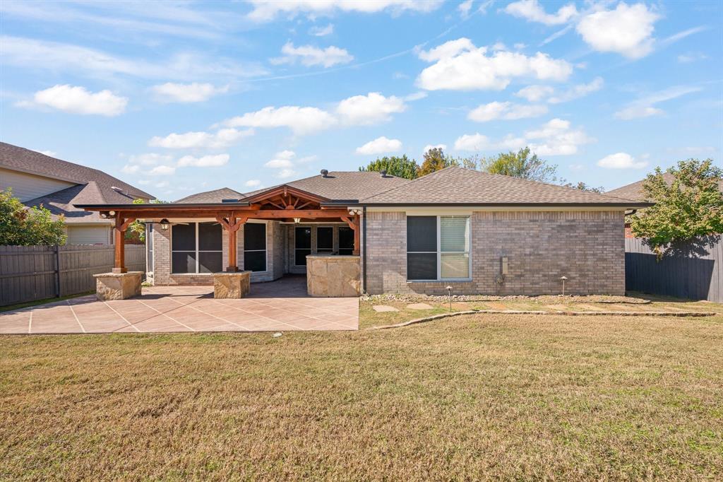 7103 Camp Creek Drive Arlington, TX 76002 - Photo 26 of 29 a front view of a house with yard patio and swimming pool