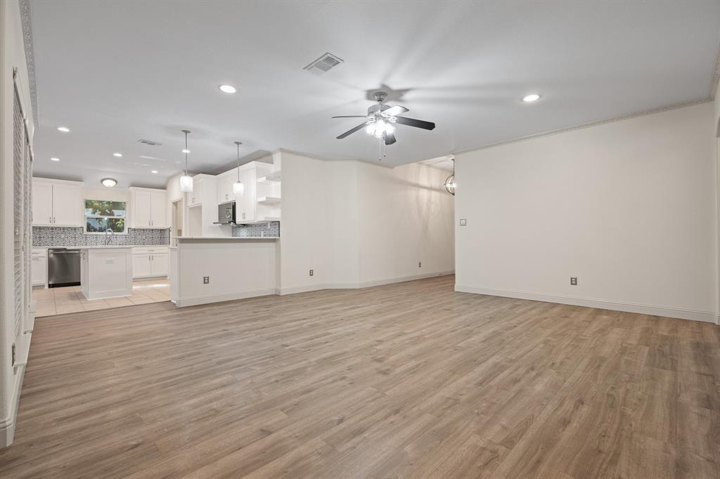 7103 Camp Creek Drive Arlington, TX 76002 - Photo 7 of 29 a view of a kitchen with a sink and a stove