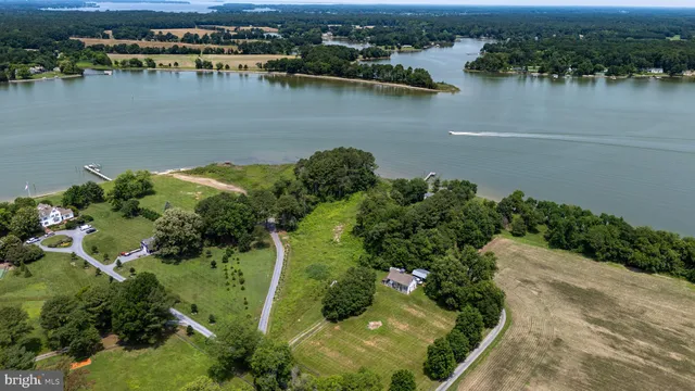 an aerial view of a houses with a lake view