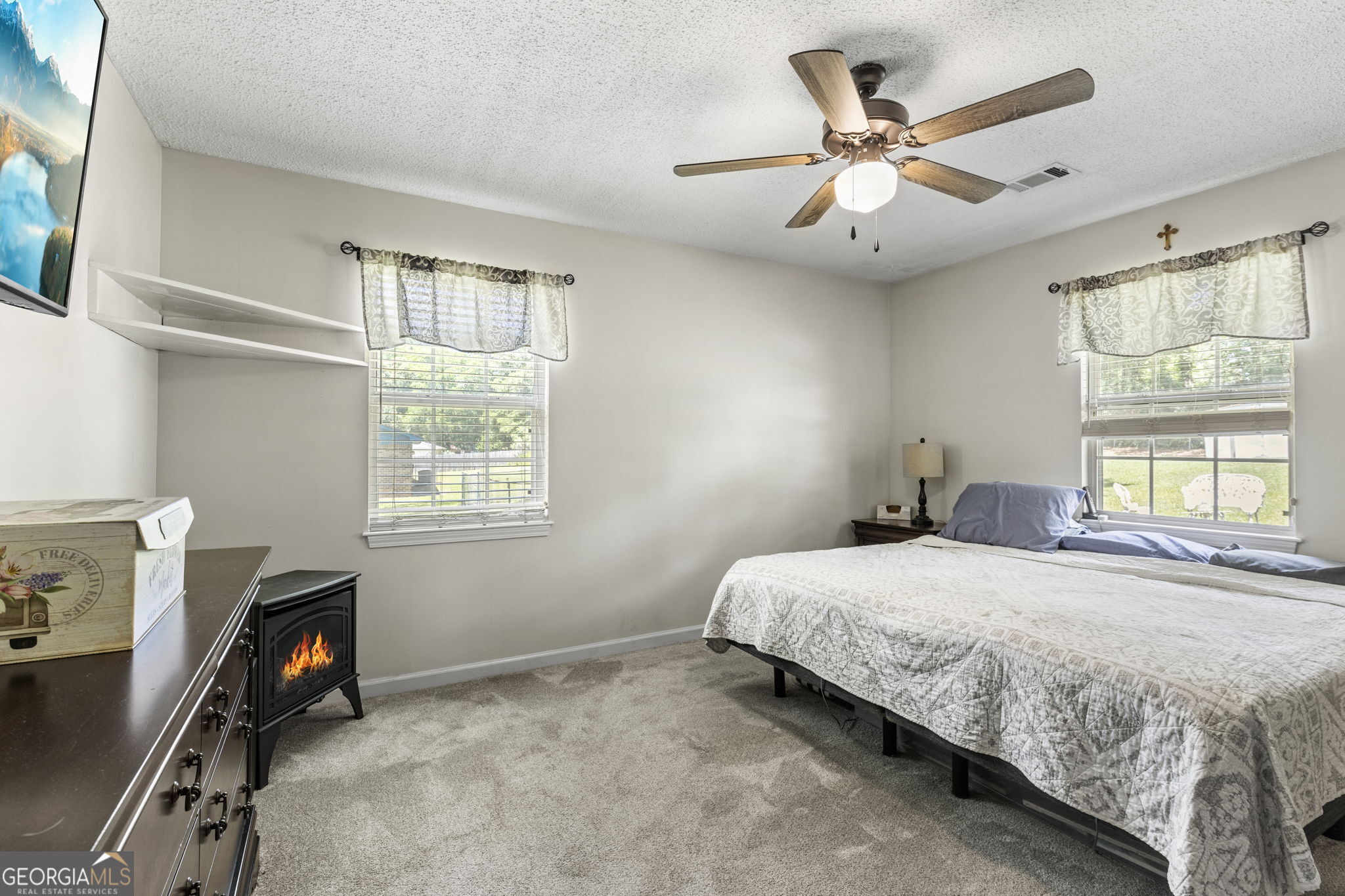 305 North Lake Drive Perry, GA 31069 - Photo 16 of 32 a bedroom with a bed and a window
