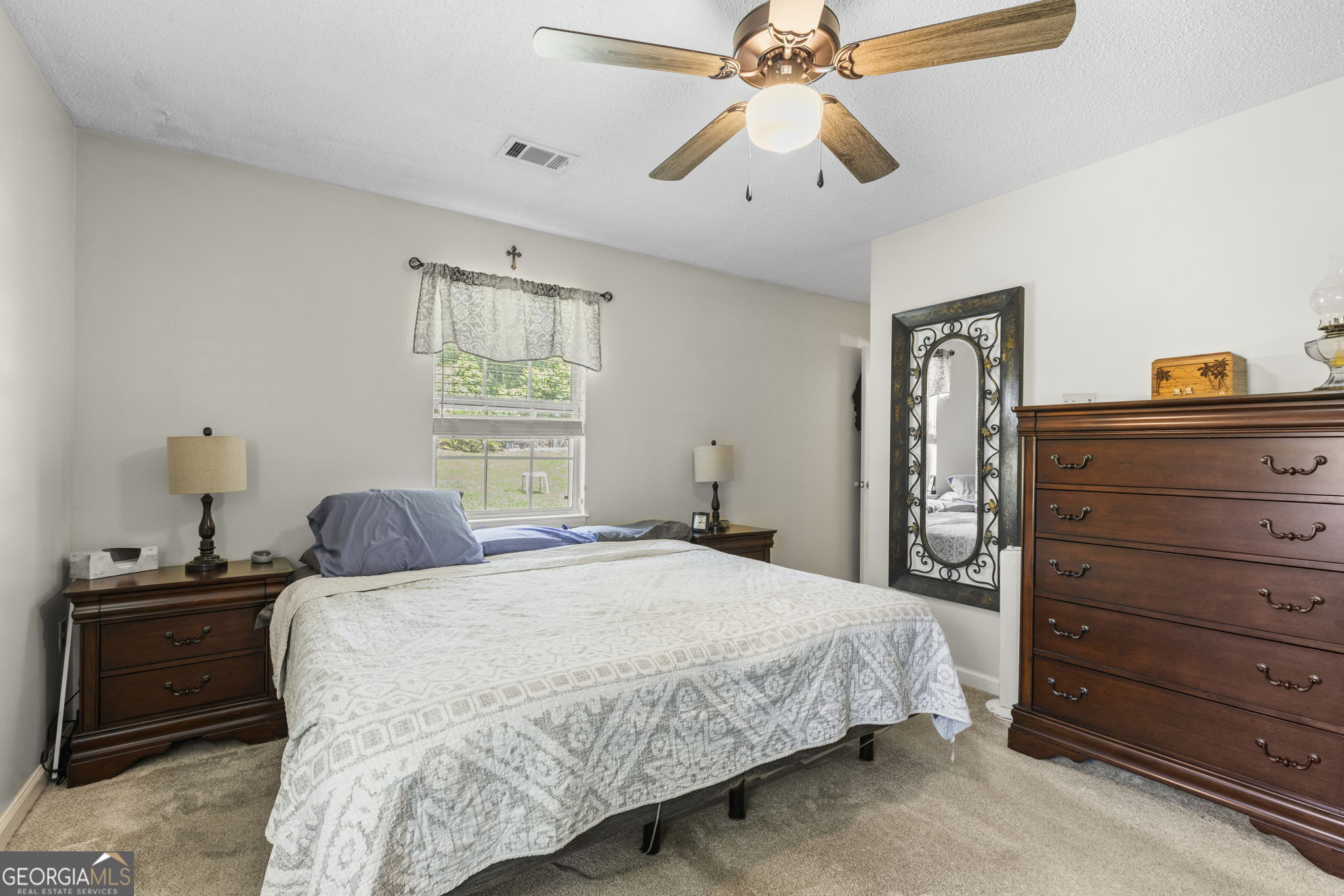 305 North Lake Drive Perry, GA 31069 - Photo 17 of 32 a bedroom with a bed and a closet
