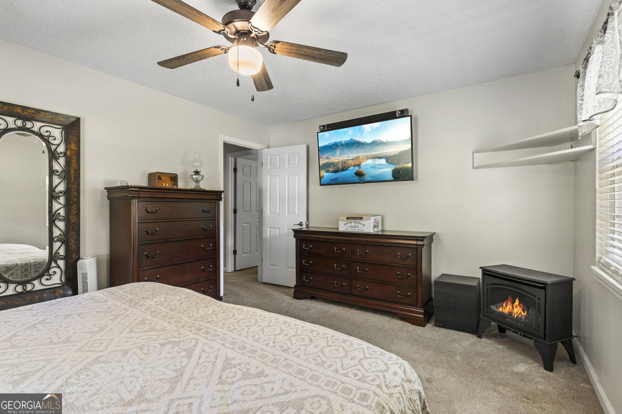 305 North Lake Drive Perry, GA 31069 - Photo 18 of 32 a bedroom with a bed and a television