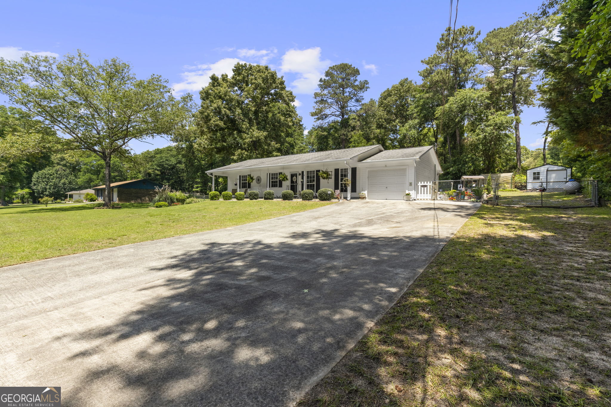 305 North Lake Drive Perry, GA 31069 - Photo 2 of 32 a view of a house with pool and a yard