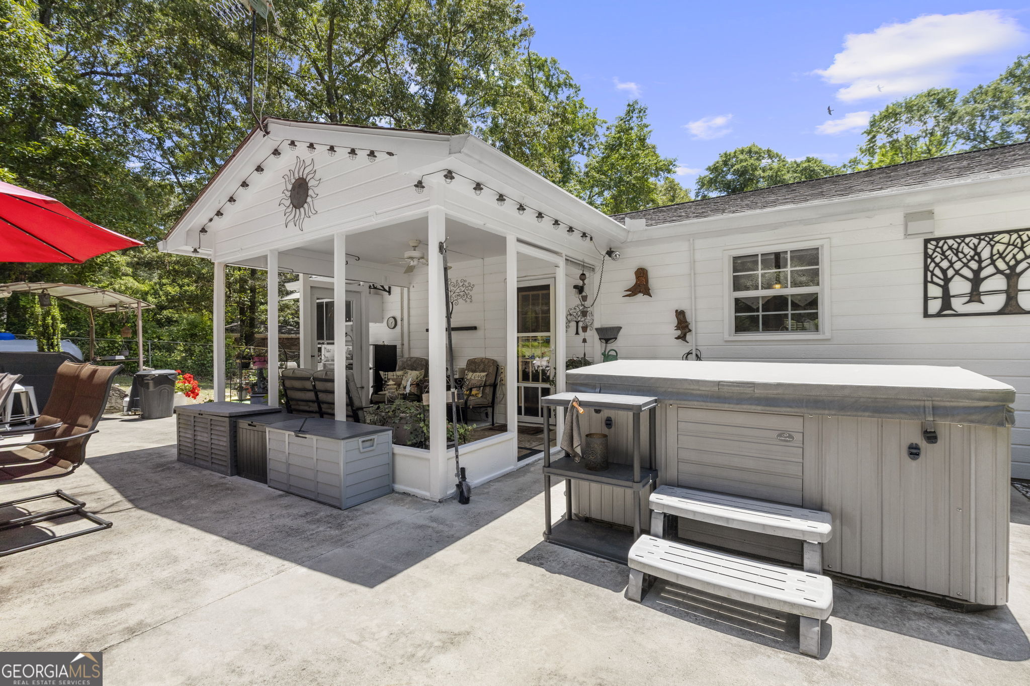 305 North Lake Drive Perry, GA 31069 - Photo 26 of 32 a view of a patio with a tv and outdoor seating