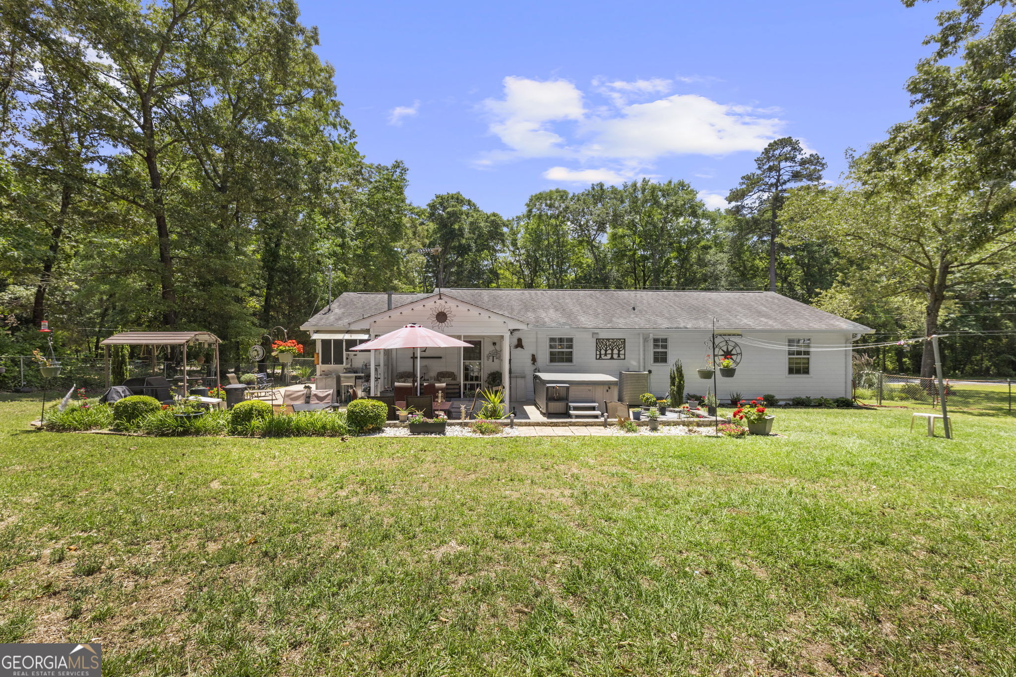 305 North Lake Drive Perry, GA 31069 - Photo 28 of 32 a view of a house with backyard and trees