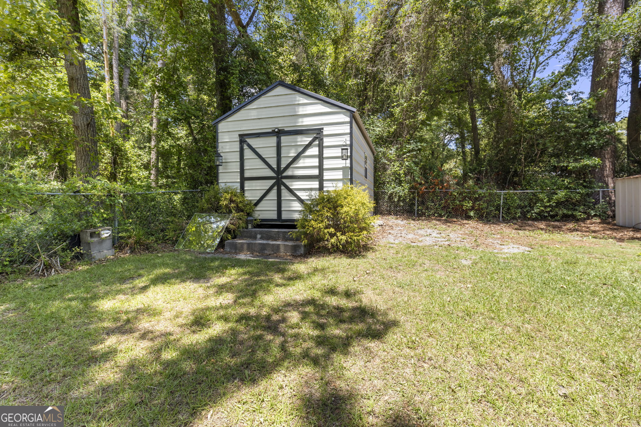 305 North Lake Drive Perry, GA 31069 - Photo 30 of 32 a view of a house with a yard