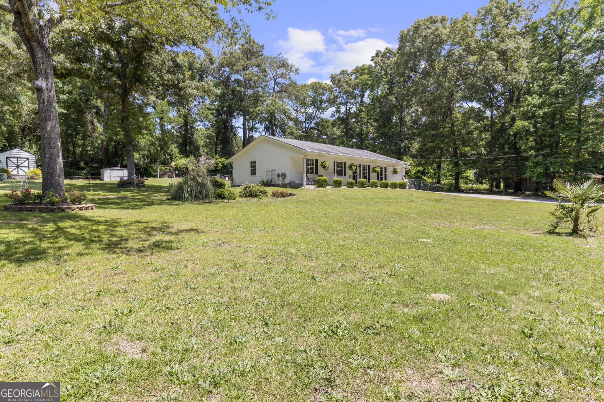 305 North Lake Drive Perry, GA 31069 - Photo 3 of 32 a big house with big yard and large trees