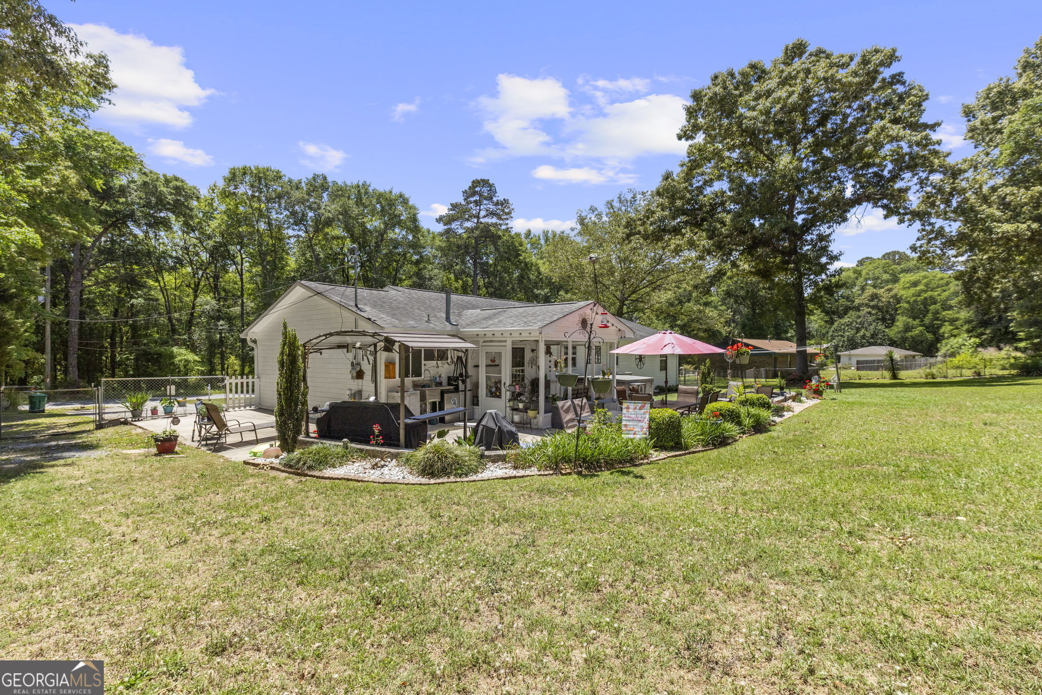 305 North Lake Drive Perry, GA 31069 - Photo 32 of 32 a view of a house with a yard patio and fire pit