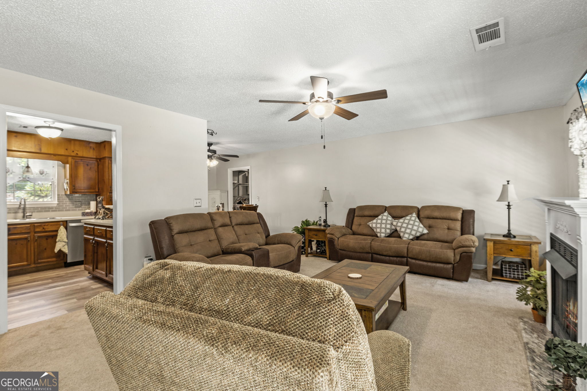 305 North Lake Drive Perry, GA 31069 - Photo 7 of 32 a living room with furniture ceiling fan and a window