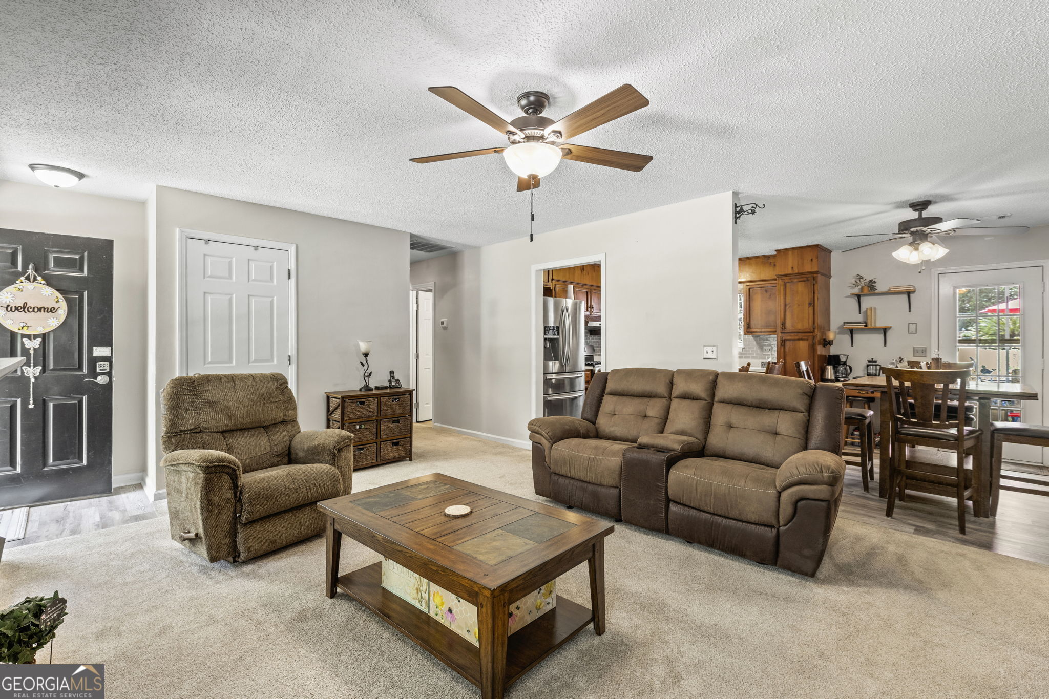 305 North Lake Drive Perry, GA 31069 - Photo 10 of 32 a living room with furniture and a ceiling fan