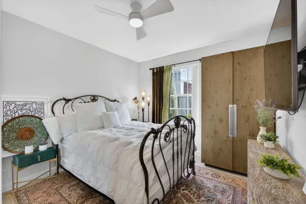 a bathroom with a double vanity sink a mirror a shower and a bathtub