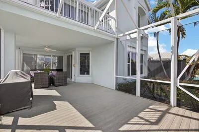 a view of a balcony with wooden floor