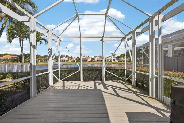 a view of a lake with houses in the back