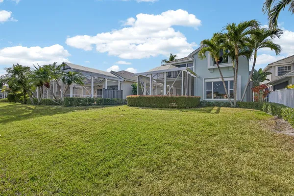 a view of a lake with houses in the back