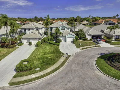 an aerial view of a house with a lake view