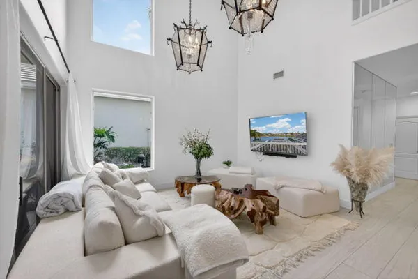 a bedroom with furniture and a flat screen tv