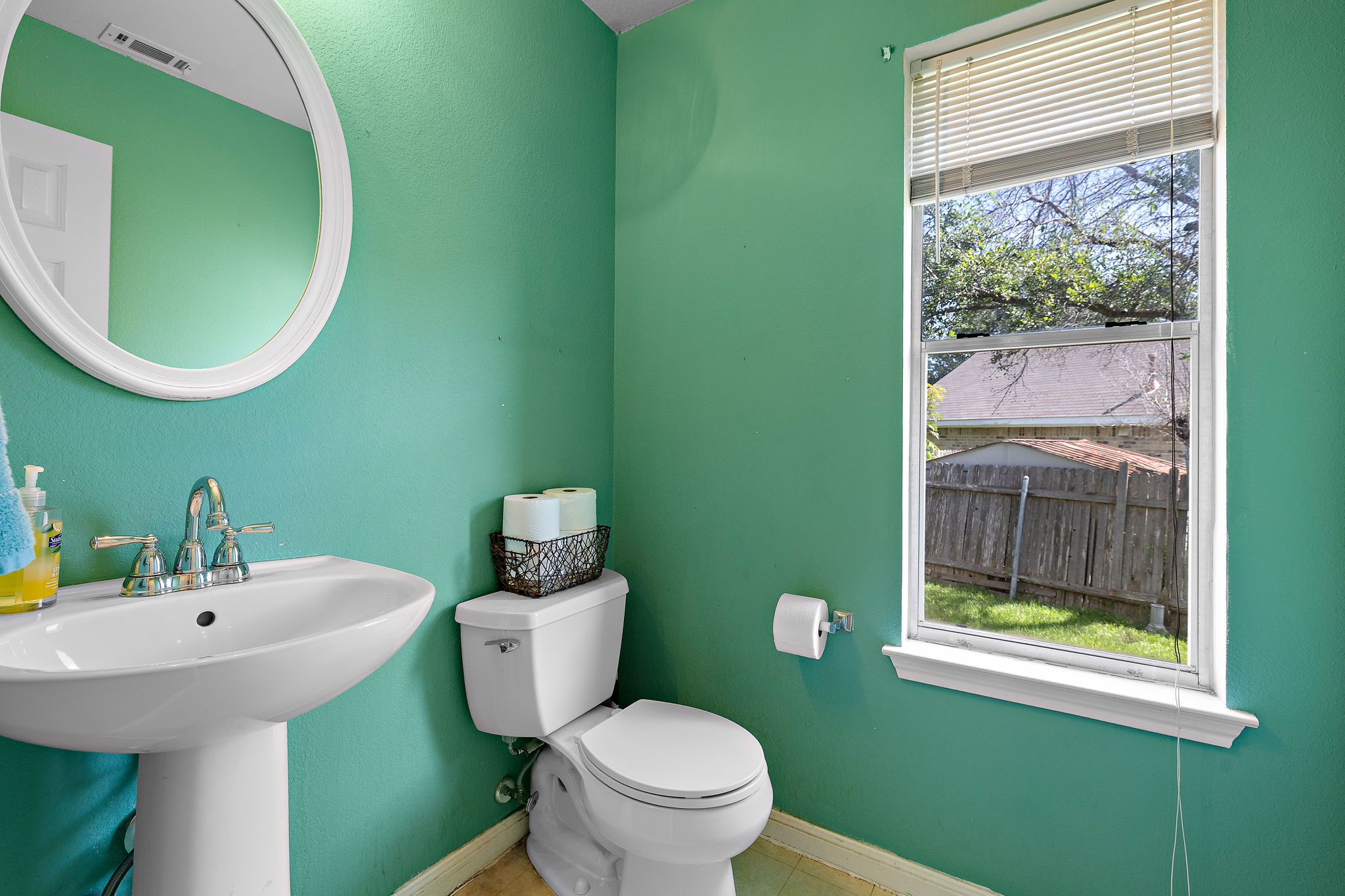 615 Runners Ridge Pflugerville, TX 78660 - Photo 26 of 32 a bathroom with a sink mirror and toilet