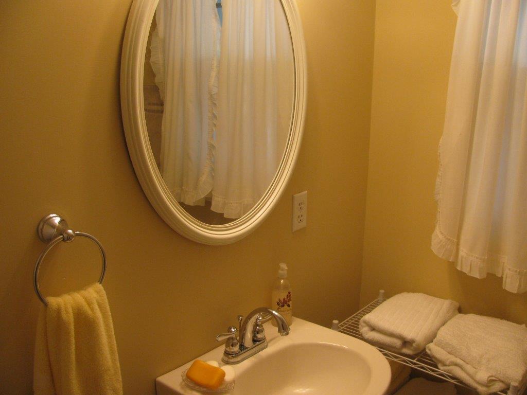 120 Saunders Shop Road Gretna, VA 24557 - Photo 14 of 32 a bathroom with a sink and a mirror