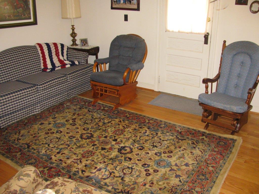 120 Saunders Shop Road Gretna, VA 24557 - Photo 20 of 32 a living room with furniture and a wooden floor