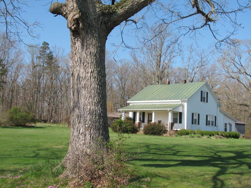 120 Saunders Shop Road Gretna, VA 24557 - Photo 3 of 32 a front view of a house with a garden