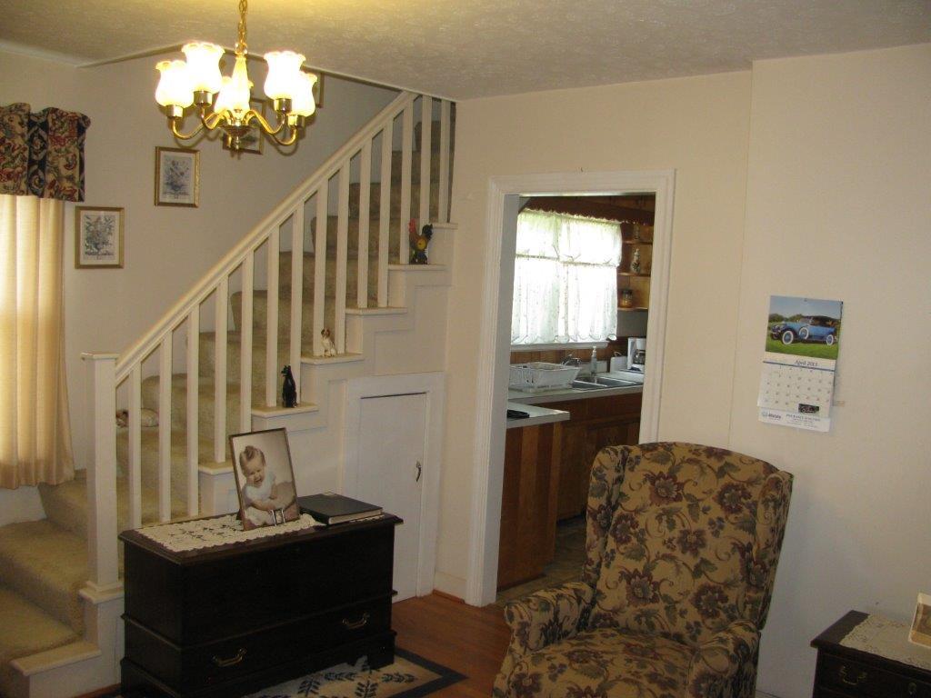 120 Saunders Shop Road Gretna, VA 24557 - Photo 24 of 32 a view of a livingroom with furniture a ceiling fan and windows