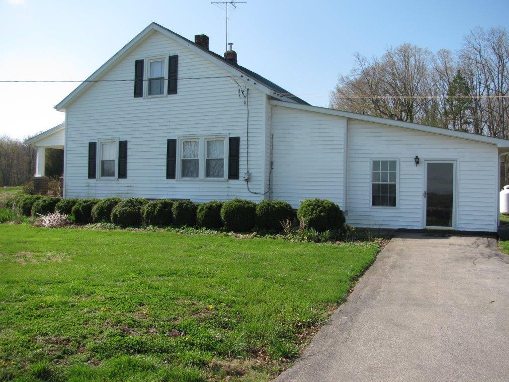 120 Saunders Shop Road Gretna, VA 24557 - Photo 9 of 32 a front view of a house with a yard and garage
