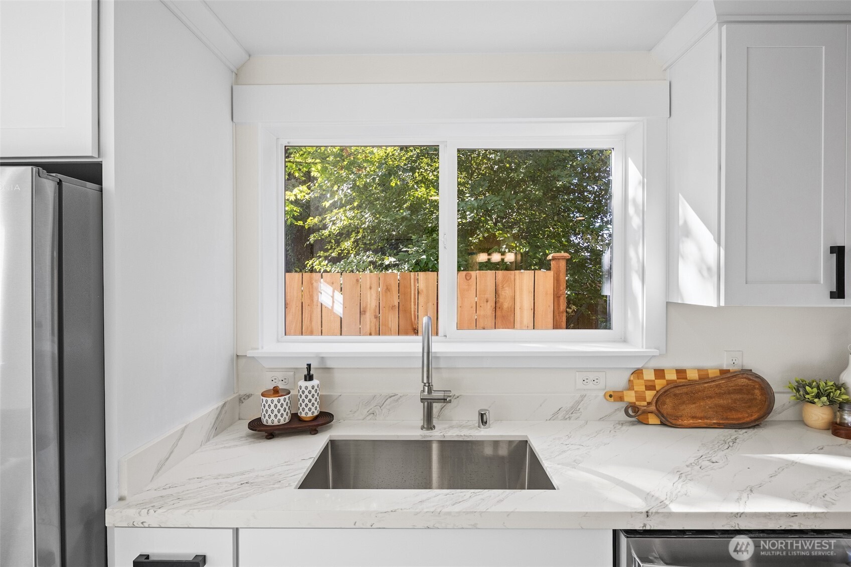 9545 Wallingford Avenue North Seattle, WA 98103 - Photo 11 of 22 a kitchen with a sink and a window