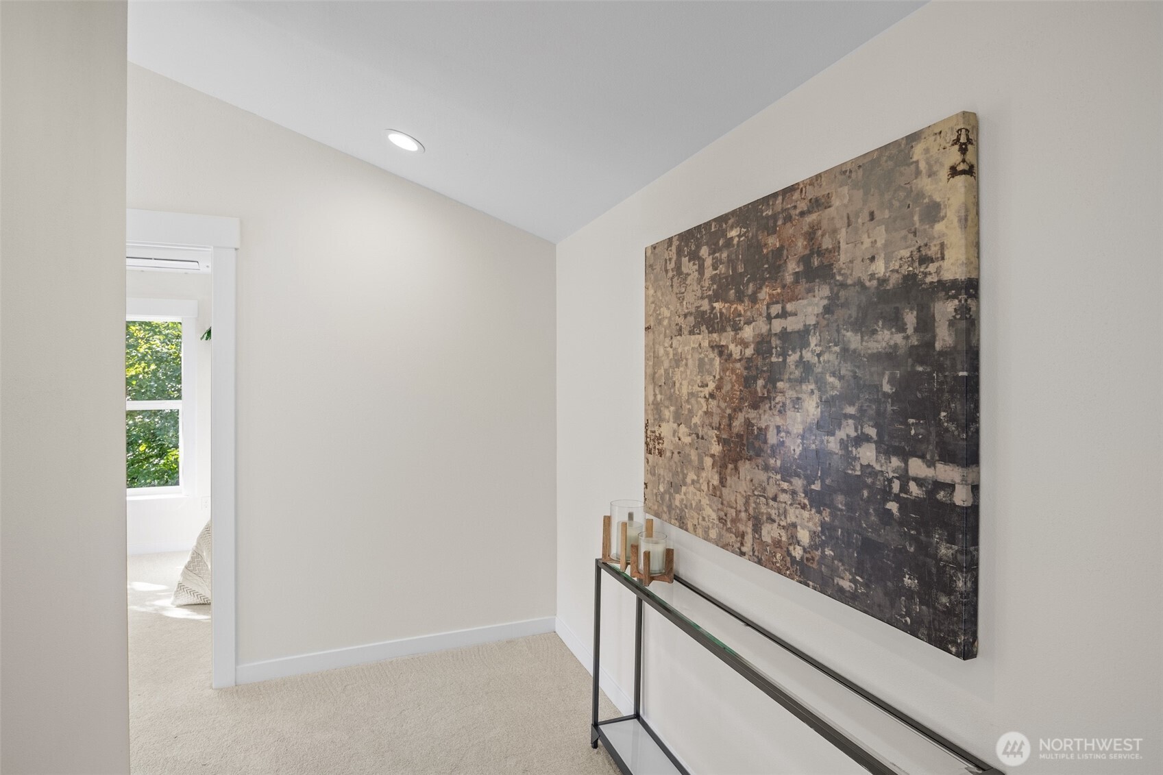 9545 Wallingford Avenue North Seattle, WA 98103 - Photo 14 of 22 a room with a wooden floor and a window