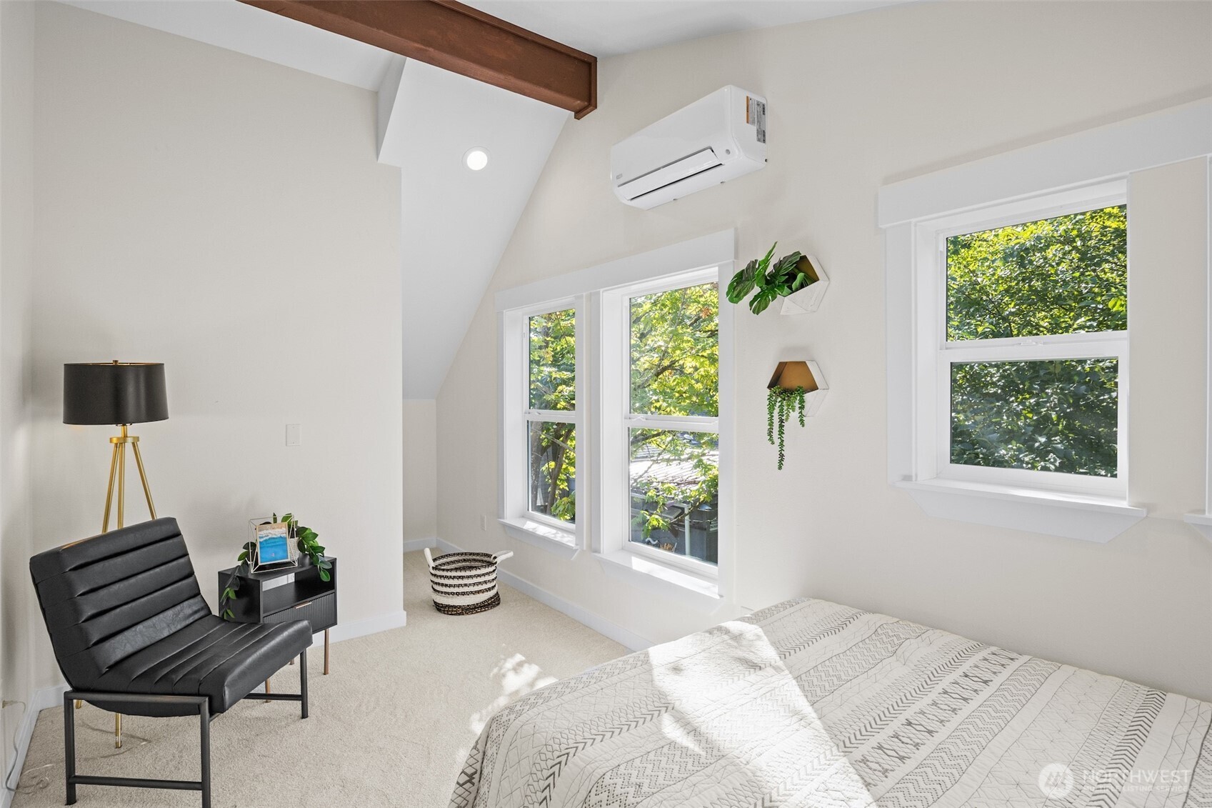 9545 Wallingford Avenue North Seattle, WA 98103 - Photo 15 of 22 a bedroom with a bed and a chair
