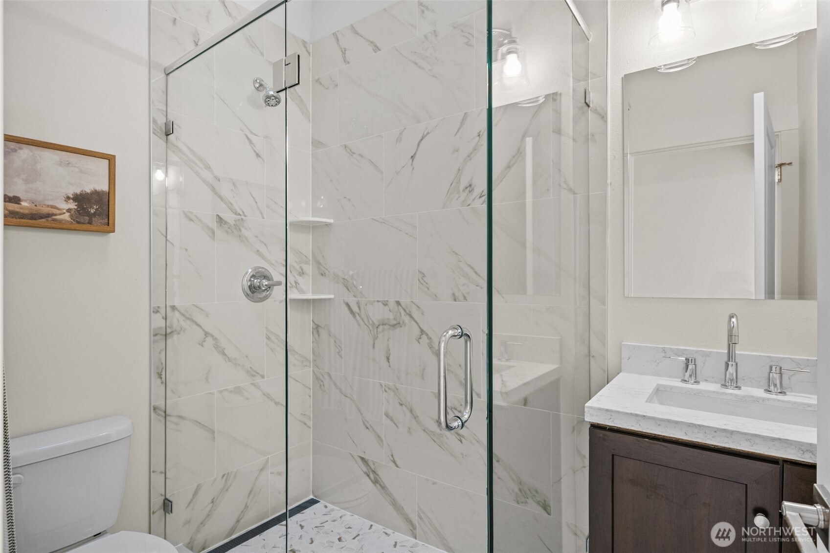 9545 Wallingford Avenue North Seattle, WA 98103 - Photo 18 of 22 a bathroom with a shower sink and mirror