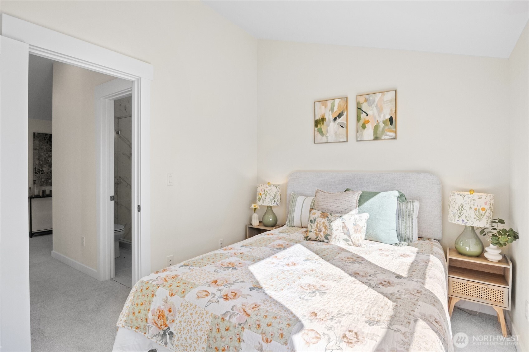 9545 Wallingford Avenue North Seattle, WA 98103 - Photo 19 of 22 a bedroom with a bed and a painting on the wall