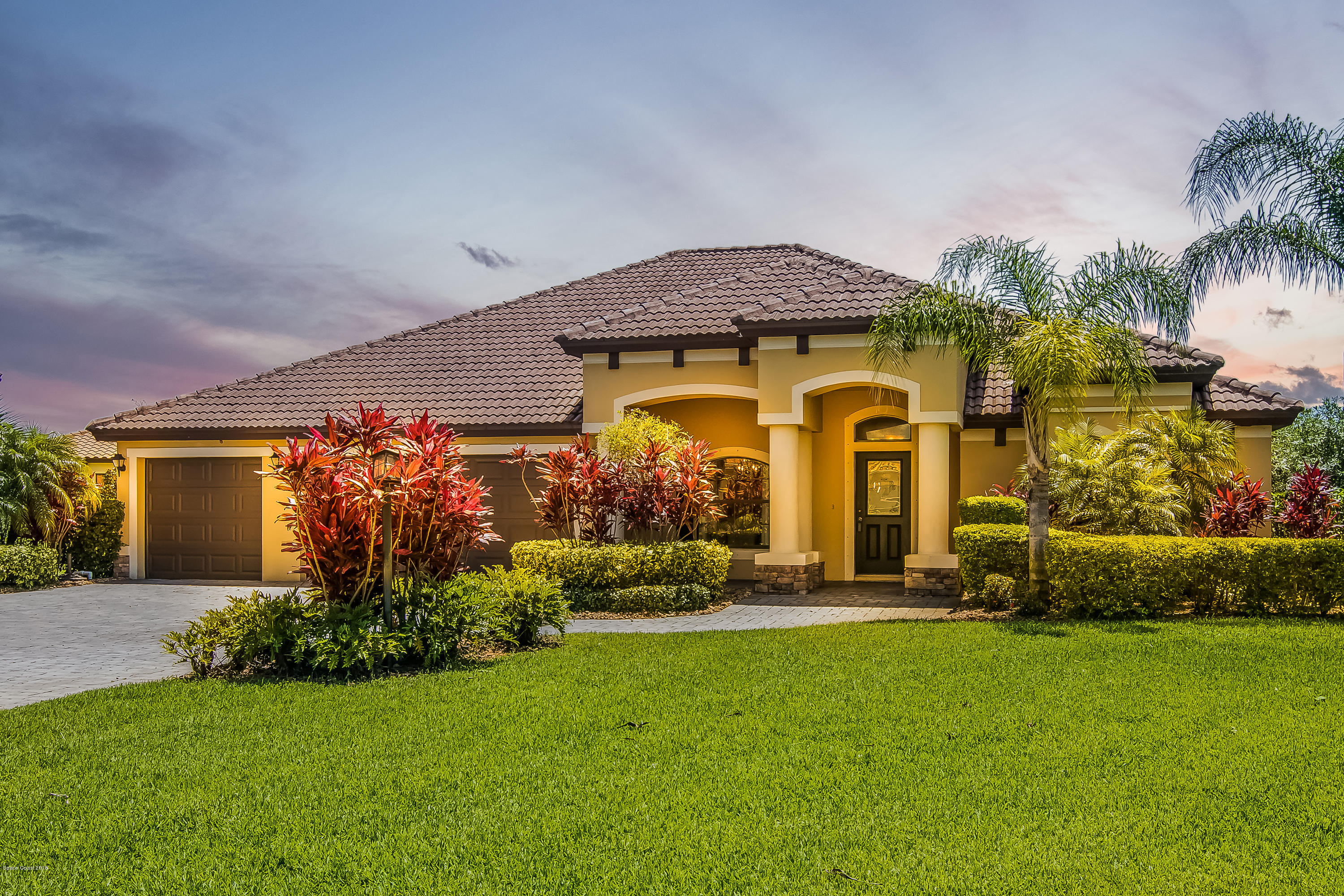 4025 Waterloo Place Melbourne, FL 32940 - Photo 1 of 29 front view of a house with a garden