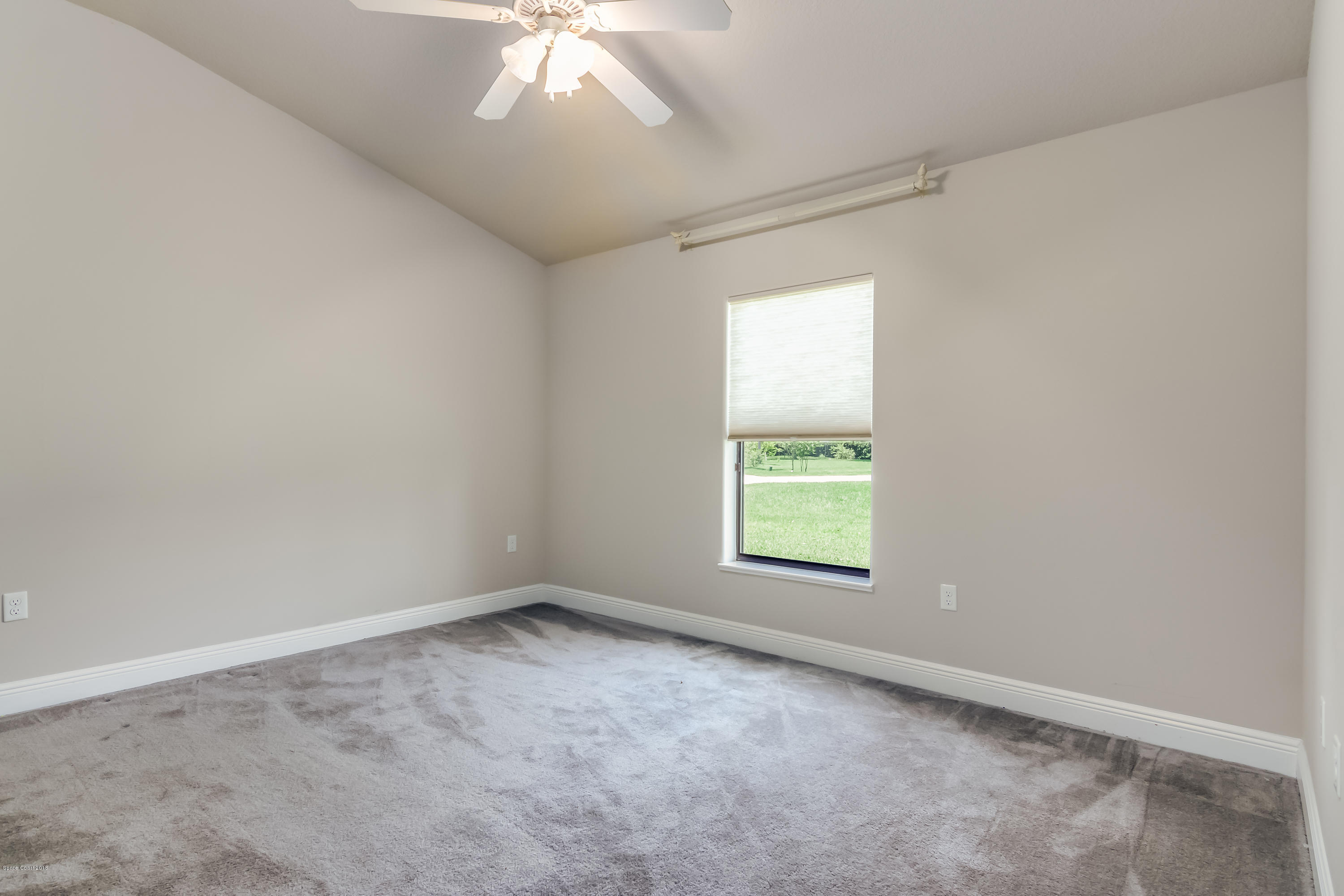 4025 Waterloo Place Melbourne, FL 32940 - Photo 18 of 29 an empty room with a window