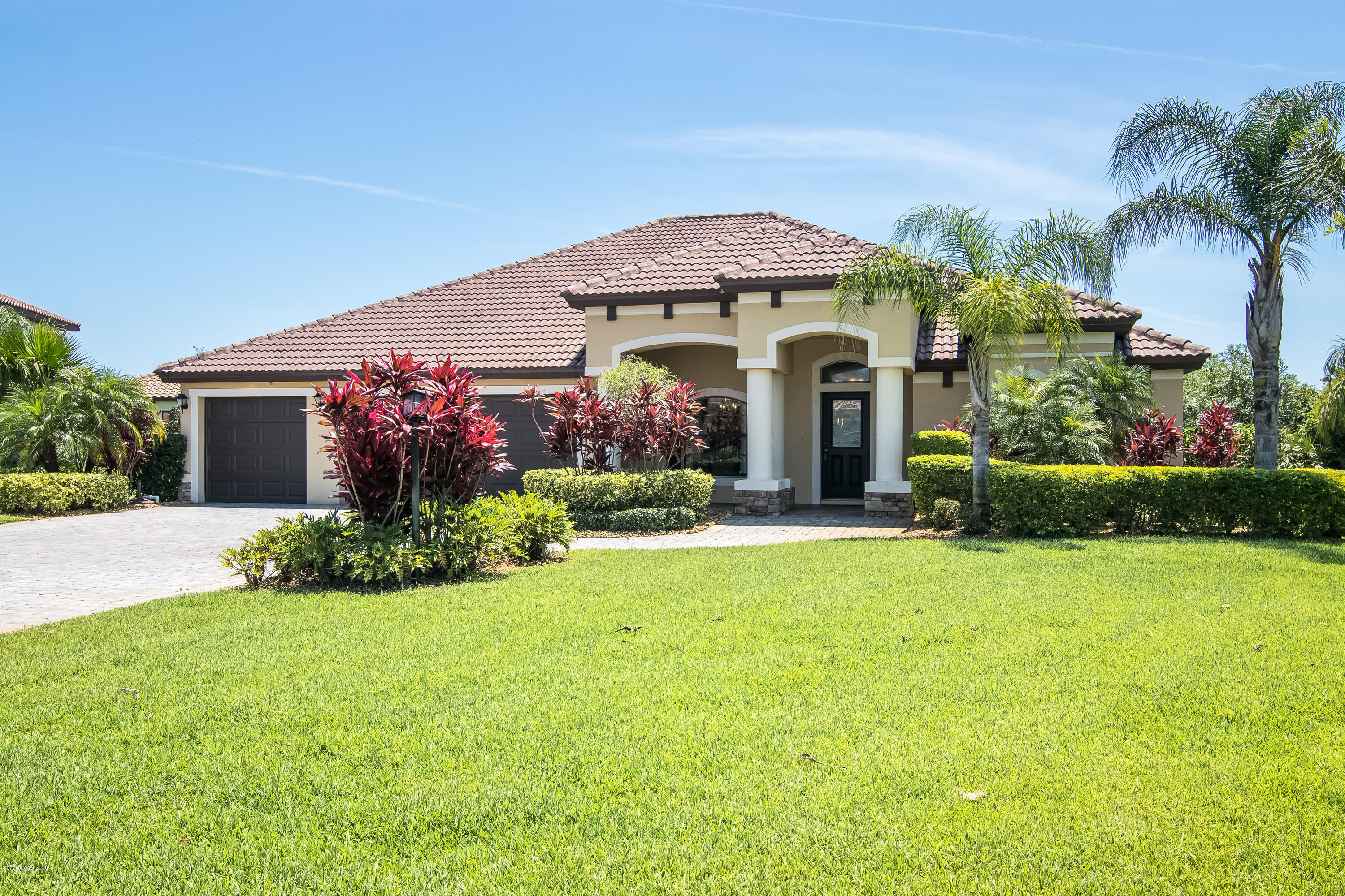 4025 Waterloo Place Melbourne, FL 32940 - Photo 3 of 29 a front view of a house with a yard