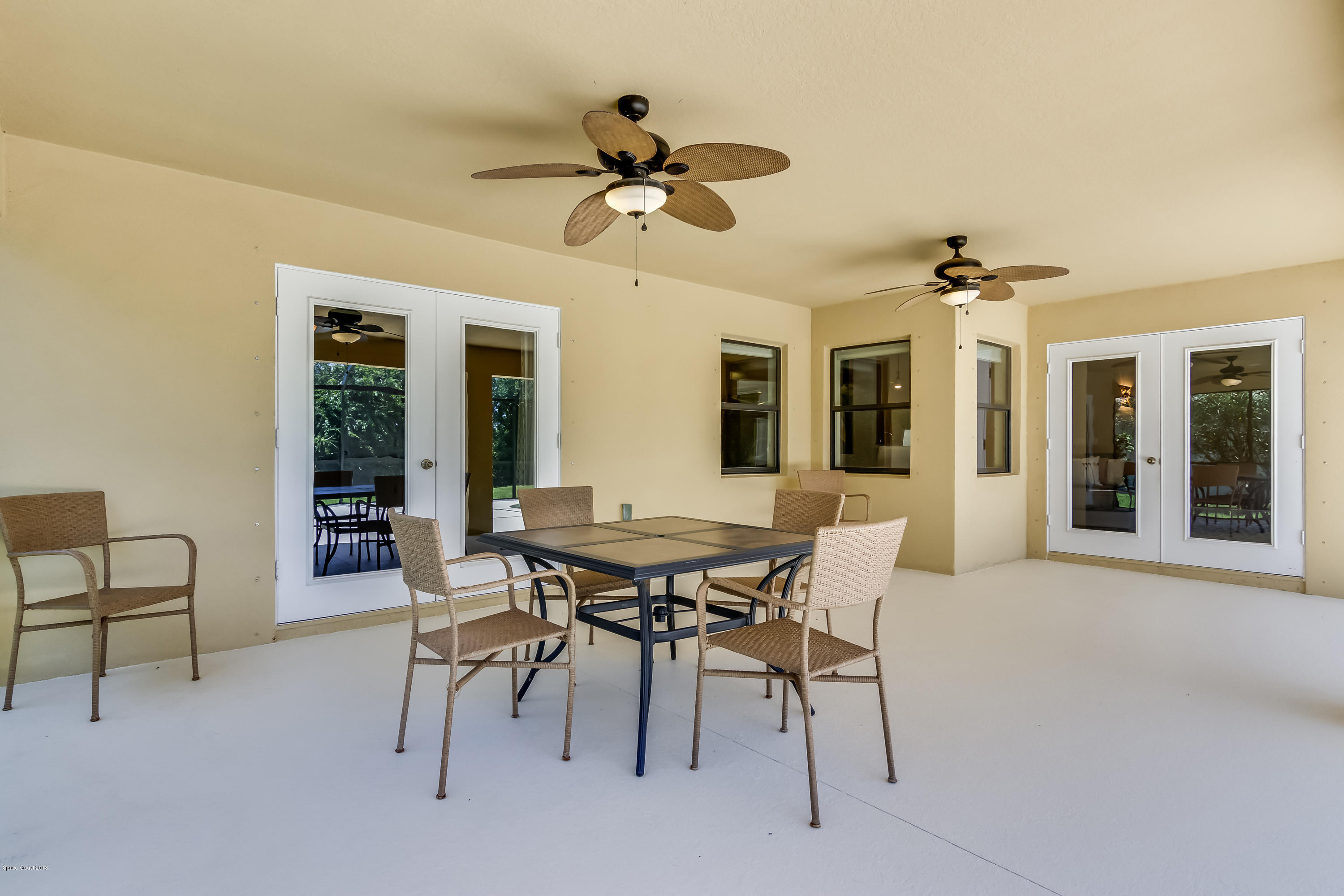 4025 Waterloo Place Melbourne, FL 32940 - Photo 22 of 29 a view of a dining room with furniture and a chandelier