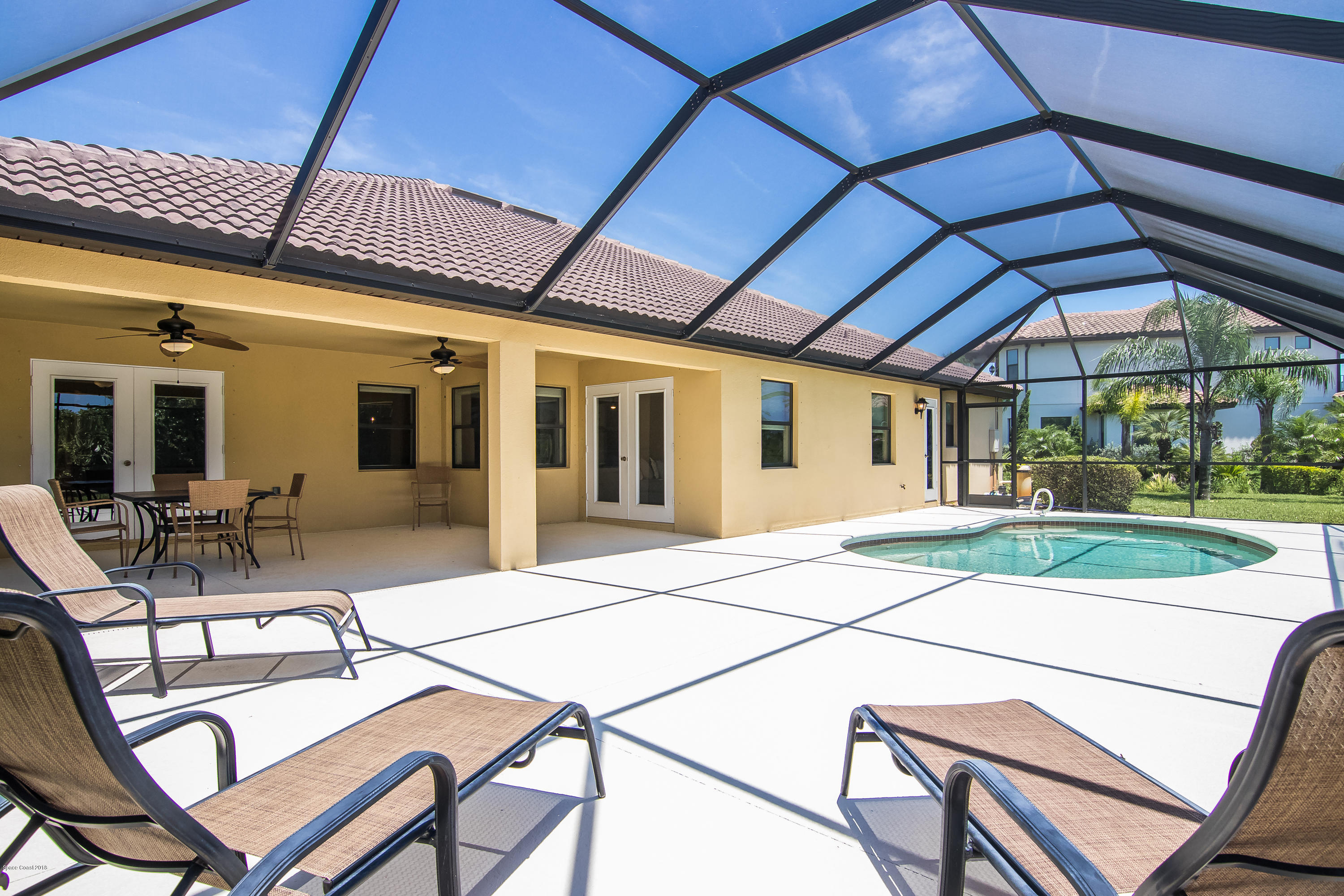 4025 Waterloo Place Melbourne, FL 32940 - Photo 23 of 29 a patio with a table and chairs