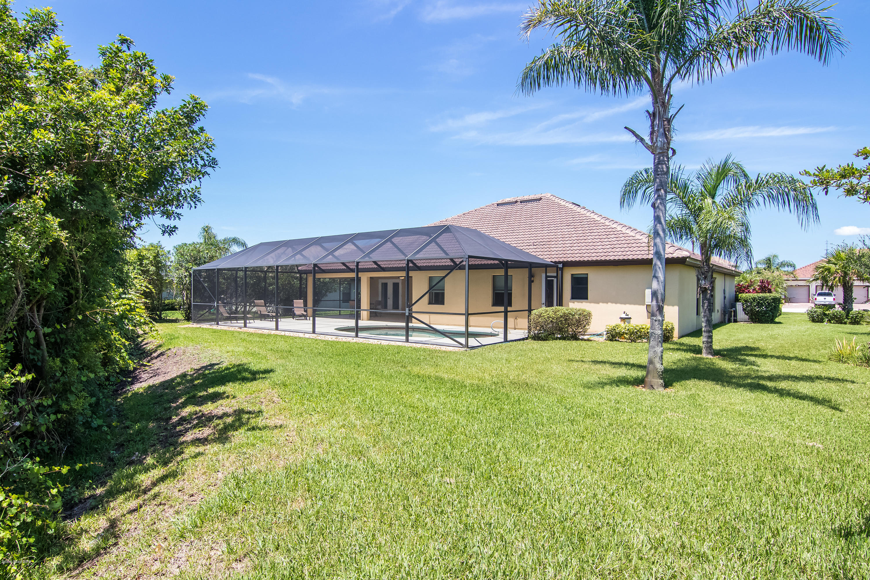 4025 Waterloo Place Melbourne, FL 32940 - Photo 25 of 29 a front view of a house with garden