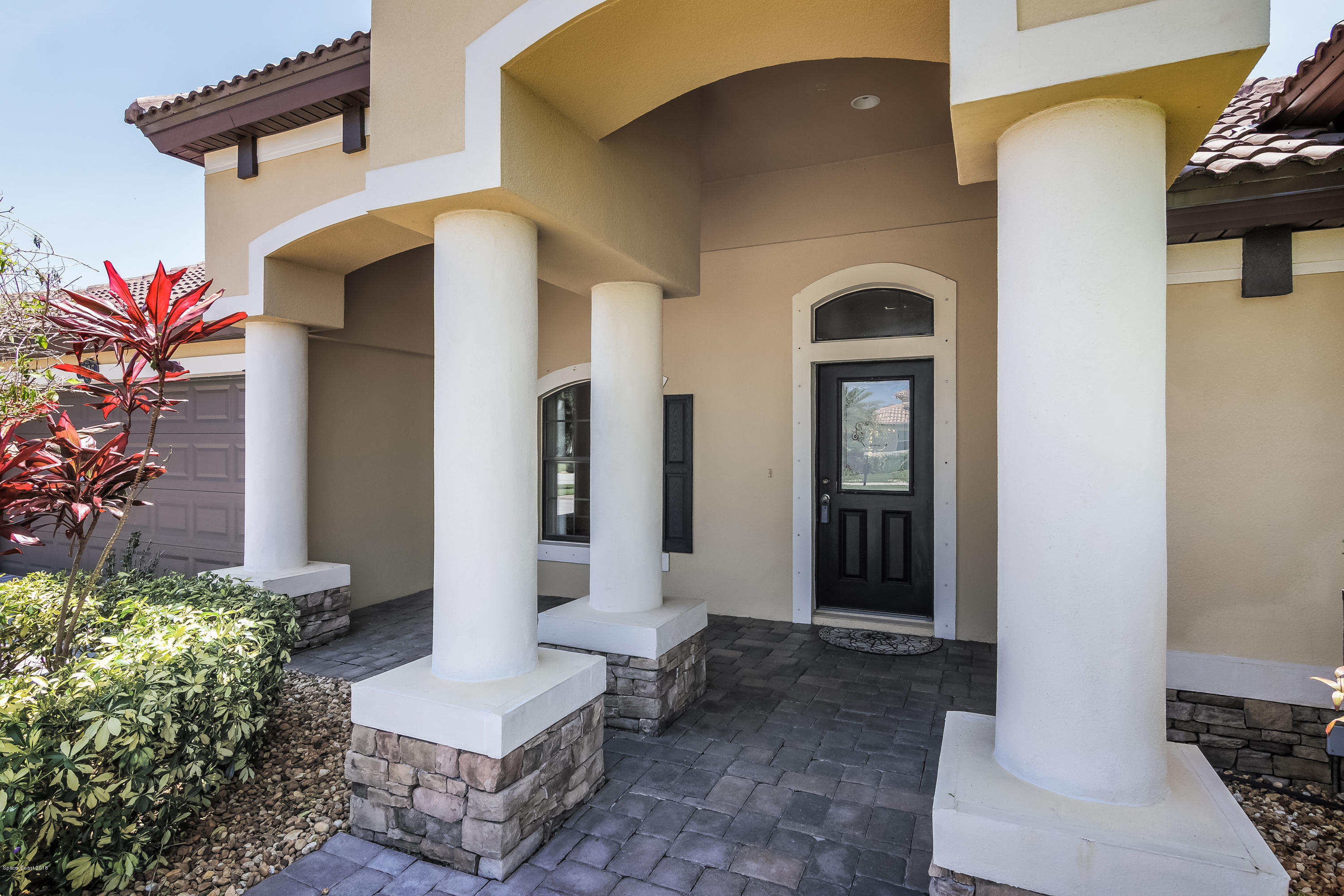 4025 Waterloo Place Melbourne, FL 32940 - Photo 5 of 29 a front view of a house with garden
